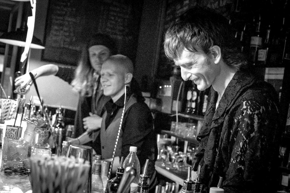 Mark Tsermenjov, Emil Folek and Jake Page behind the bar